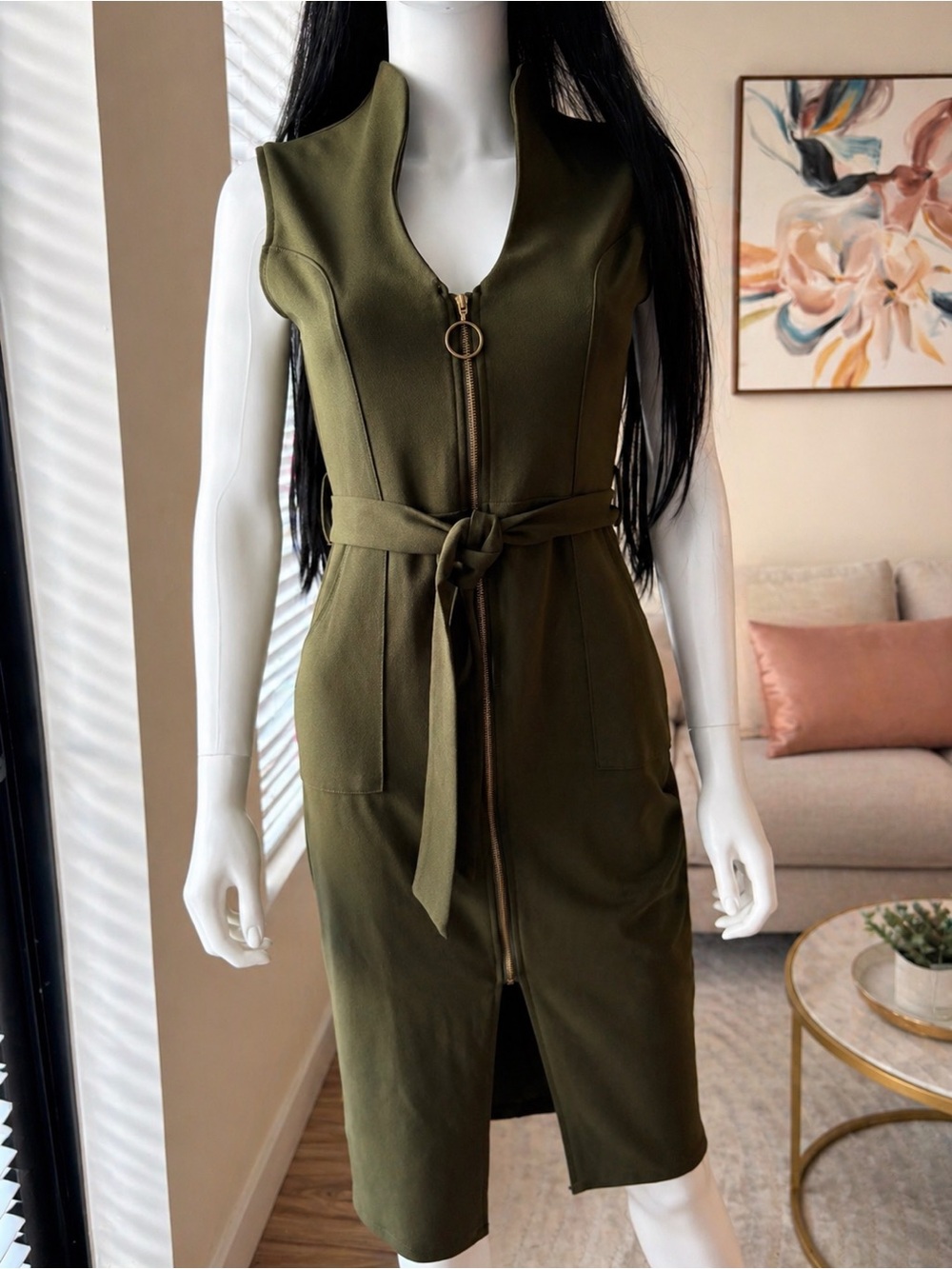 Stunning olive green sleeveless dress with a modern, edgy touch